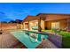 Beautiful pool area with a covered patio, seating, and a well-maintained brick surround at 7235 Summer Air Ave, Las Vegas, NV 89179