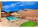 Backyard pool featuring a sun umbrella on a brick patio, ideal for relaxation and enjoying outdoor recreation at 7235 Summer Air Ave, Las Vegas, NV 89179