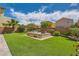 Picturesque backyard showcases a built-in hot tub, manicured lawn, and privacy wall at 7424 Rainford St, Las Vegas, NV 89148