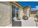 Private balcony featuring comfortable seating with views of the surrounding neighborhood at 7424 Rainford St, Las Vegas, NV 89148