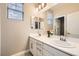 Bathroom featuring double sinks with a modern design and bright lighting at 7424 Rainford St, Las Vegas, NV 89148
