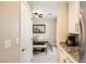Hallway view of the dining area featuring a wood table and upholstered chairs at 7424 Rainford St, Las Vegas, NV 89148