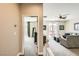 Upstairs living room showcasing a cozy space, ceiling fan, and sliding glass doors at 7424 Rainford St, Las Vegas, NV 89148