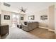 Comfortable living room with plush carpet, ceiling fan and neutral-toned walls at 7424 Rainford St, Las Vegas, NV 89148