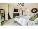 Comfortable main bedroom with plush bedding and ensuite bathroom access at 7424 Rainford St, Las Vegas, NV 89148