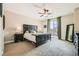 Spacious main bedroom with king-size bed and access to balcony at 7424 Rainford St, Las Vegas, NV 89148