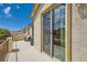 Private balcony with views of neighborhood rooftops and sunny blue skies at 7424 Rainford St, Las Vegas, NV 89148