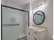 Updated bathroom featuring a glass enclosed shower, modern vanity with sink, and neutral color palette at 75 N Valle Verde Dr # 211, Henderson, NV 89074