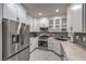 This kitchen features white cabinets, stainless steel appliances, and granite countertops at 75 N Valle Verde Dr # 211, Henderson, NV 89074