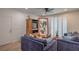 Cozy living room with plush seating, ceiling fan and natural light from the window at 75 N Valle Verde Dr # 211, Henderson, NV 89074