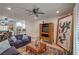 Open floor plan connects the living room to the kitchen, with hardwood floors and plush seating at 75 N Valle Verde Dr # 211, Henderson, NV 89074