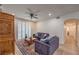 Comfortable living room with recessed lighting, ceiling fan, and access to hallway at 75 N Valle Verde Dr # 211, Henderson, NV 89074