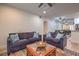 Inviting living room with plush seating, hardwood floors and vintage accents at 75 N Valle Verde Dr # 211, Henderson, NV 89074