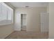Bedroom with tan walls and carpet flooring featuring a closet with sliding doors at 7544 Coral River Dr, Las Vegas, NV 89131