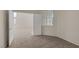 Comfortable bedroom with neutral carpet and bright, natural light, plus an open door to another room at 7544 Coral River Dr, Las Vegas, NV 89131