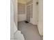 A covered entryway with a security screen door and textured walls at 7544 Coral River Dr, Las Vegas, NV 89131