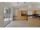 Bright eat-in kitchen features granite counters, tile flooring, and a sliding glass door to the patio at 7544 Coral River Dr, Las Vegas, NV 89131
