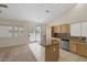 Open kitchen area with a large island, stainless steel appliances, and a sliding door to the patio at 7544 Coral River Dr, Las Vegas, NV 89131