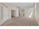 Open-concept living area showcases plush carpeting and a seamless flow between rooms at 7544 Coral River Dr, Las Vegas, NV 89131