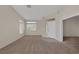 Spacious living room with plush carpeting and natural light coming through windows at 7544 Coral River Dr, Las Vegas, NV 89131