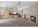 Spacious living room integrates the kitchen and features a fireplace, enhancing the open layout and inviting atmosphere at 7544 Coral River Dr, Las Vegas, NV 89131