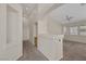 Spacious living room with a ceiling fan, neutral colors, carpet, lots of natural light, and an open floor plan at 7544 Coral River Dr, Las Vegas, NV 89131