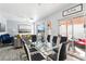 Bright dining area with a glass table and direct access to the backyard patio at 7925 Limbwood Ct, Las Vegas, NV 89131
