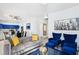 Open-concept living area with modern furniture and a view of the kitchen at 7925 Limbwood Ct, Las Vegas, NV 89131
