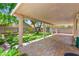 Covered patio, lush yard and mature landscaping combine to make this a wonderful outdoor space at 8113 Danaides Ct, Las Vegas, NV 89131