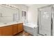 Spacious bathroom with double vanity, soaking tub, and separate glass shower at 8113 Danaides Ct, Las Vegas, NV 89131