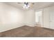 Neutral bedroom with carpeted floors leading to a bathroom with separate tub and shower at 8113 Danaides Ct, Las Vegas, NV 89131
