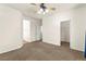 Large carpeted room with a closet and doorways leading to other areas of the house at 8113 Danaides Ct, Las Vegas, NV 89131