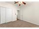 This bedroom features neutral carpet, white walls, and closet space at 8113 Danaides Ct, Las Vegas, NV 89131