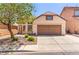 Charming single-story home with a two-car garage, desert landscaping and mature shade tree at 8113 Danaides Ct, Las Vegas, NV 89131