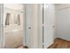 Hallway leads to carpeted bedroom, wood floors, and a door to the outside at 8113 Danaides Ct, Las Vegas, NV 89131