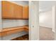Hallway with built-in desk and cabinets leads to a bedroom at 8113 Danaides Ct, Las Vegas, NV 89131