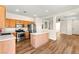 Modern kitchen with stainless steel appliances, island, and hardwood floors at 8113 Danaides Ct, Las Vegas, NV 89131