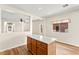 Kitchen island with white countertop and warm wood cabinetry at 8113 Danaides Ct, Las Vegas, NV 89131