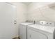 This laundry room features a full size washer and dryer at 8113 Danaides Ct, Las Vegas, NV 89131