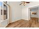 Bright living room with wood floors, lots of light, and a ceiling fan at 8113 Danaides Ct, Las Vegas, NV 89131