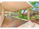 The backyard features a covered patio, with a tree and manicured backyard at 8113 Danaides Ct, Las Vegas, NV 89131