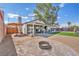 Large backyard featuring patio space and a dedicated fire pit area, great for entertaining and relaxation at 823 Spikenard Dr, Henderson, NV 89002