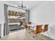 Dining area with glass doors, bringing in natural light and views of the backyard at 823 Spikenard Dr, Henderson, NV 89002