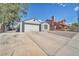 Charming home featuring a two-car garage and long driveway at 823 Spikenard Dr, Henderson, NV 89002
