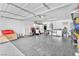 Spacious garage featuring clean floors, ample storage and shelving at 823 Spikenard Dr, Henderson, NV 89002