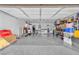 Spacious garage featuring clean floors, ample storage and shelving at 823 Spikenard Dr, Henderson, NV 89002