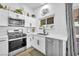 Bright kitchen with stainless steel appliances and white countertops at 823 Spikenard Dr, Henderson, NV 89002