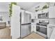 Modern kitchen with stainless steel appliances, white cabinets, and ample storage at 823 Spikenard Dr, Henderson, NV 89002