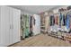 Walk-in closet features custom organization with rods and shelving for clothing and shoes at 823 Spikenard Dr, Henderson, NV 89002