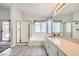 Bathroom with double sinks, a soaking tub, and a walk-in shower at 8309 Windrush Ave, Las Vegas, NV 89117